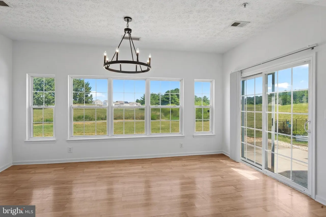 Living room with large windows and sliding doors