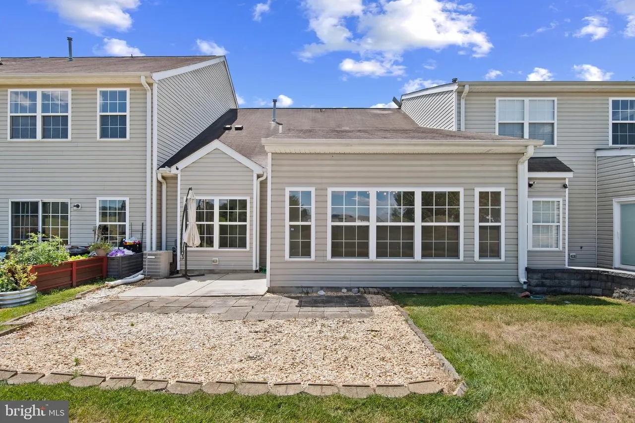 Rear of the home and backyard