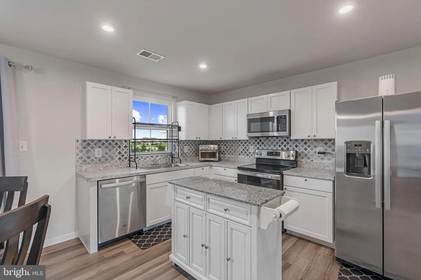Kitchen with granite counters and stainless appliances